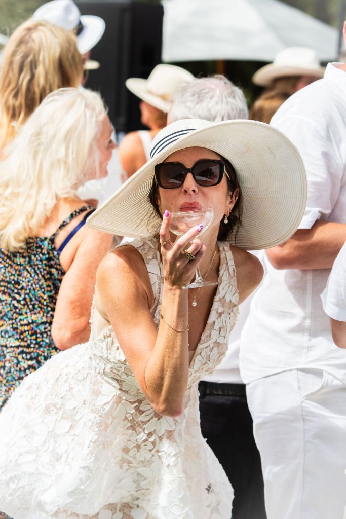 Chalk Hill White Party 2024 - guest with wine glass